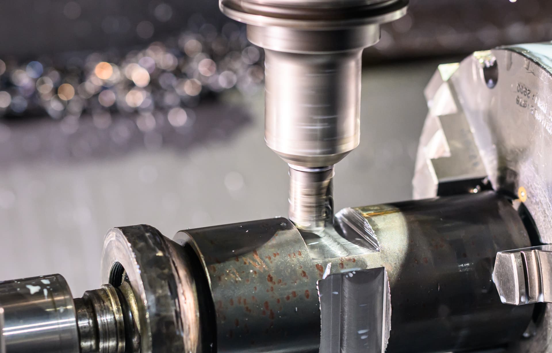 Precision drilling a steel coupler in the manufacturing machine